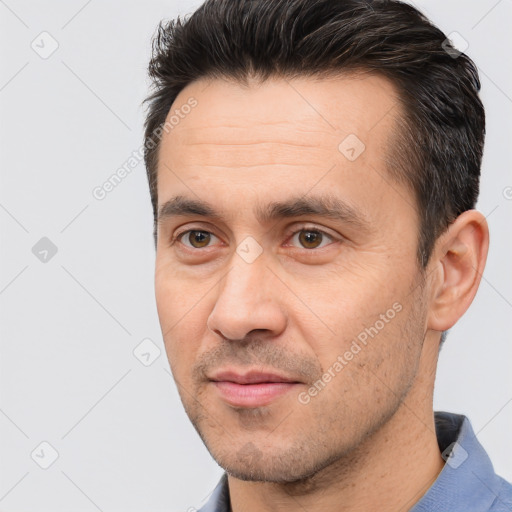 Joyful white adult male with short  brown hair and brown eyes