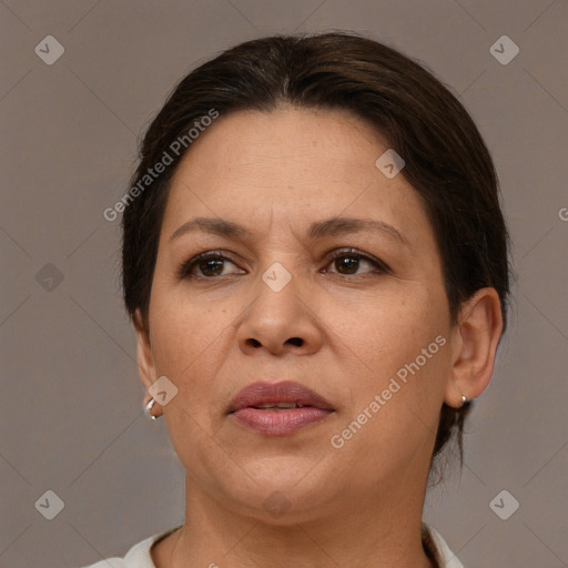 Joyful white adult female with short  brown hair and brown eyes