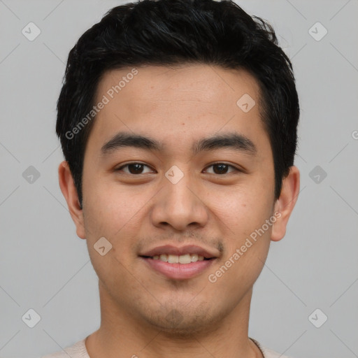 Joyful asian young-adult male with short  black hair and brown eyes