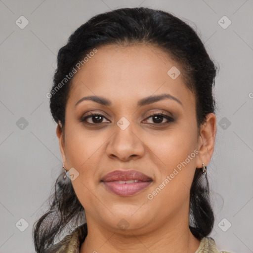 Joyful black adult female with medium  brown hair and brown eyes