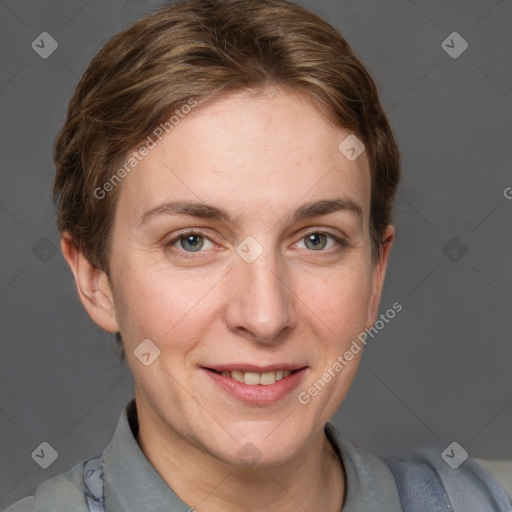 Joyful white adult female with short  brown hair and grey eyes