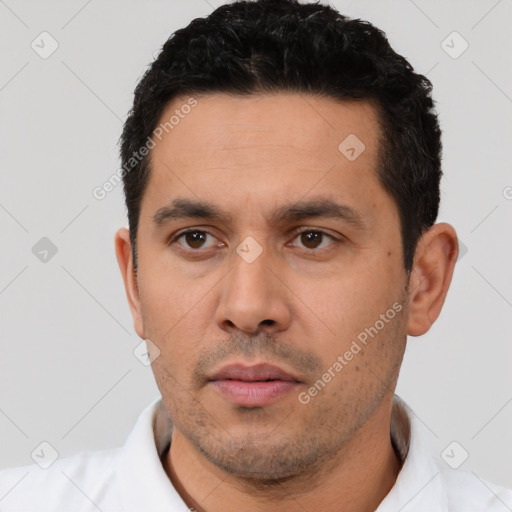 Neutral latino young-adult male with short  black hair and brown eyes