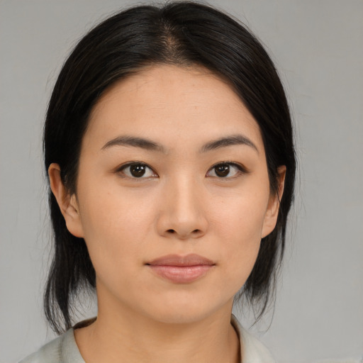 Neutral asian young-adult female with medium  brown hair and brown eyes
