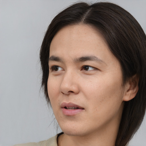 Neutral asian young-adult male with medium  brown hair and brown eyes