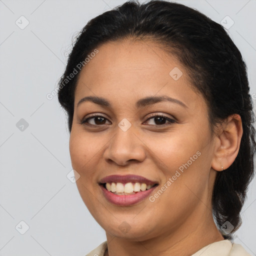 Joyful latino young-adult female with medium  brown hair and brown eyes