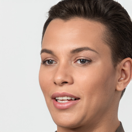 Joyful white young-adult female with short  brown hair and brown eyes