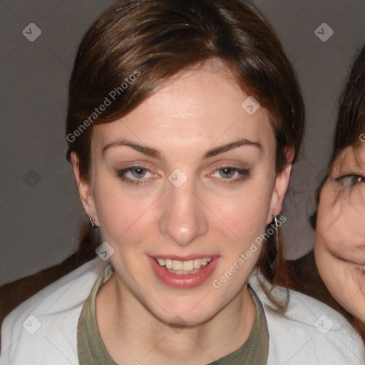 Joyful white young-adult female with medium  brown hair and blue eyes