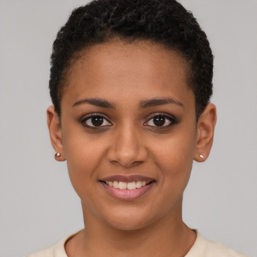 Joyful latino young-adult female with short  brown hair and brown eyes
