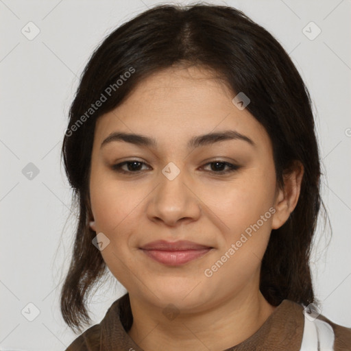 Joyful latino young-adult female with medium  brown hair and brown eyes