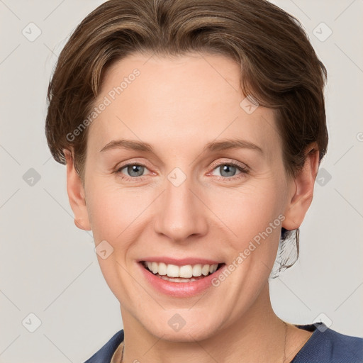 Joyful white young-adult female with short  brown hair and grey eyes