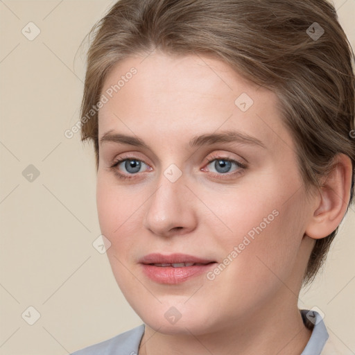 Joyful white young-adult female with medium  brown hair and blue eyes