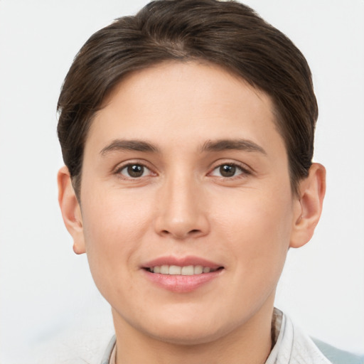 Joyful white young-adult female with short  brown hair and brown eyes