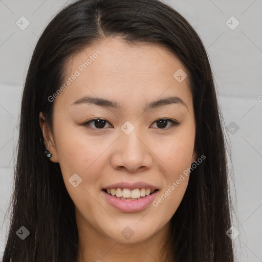 Joyful asian young-adult female with long  brown hair and brown eyes