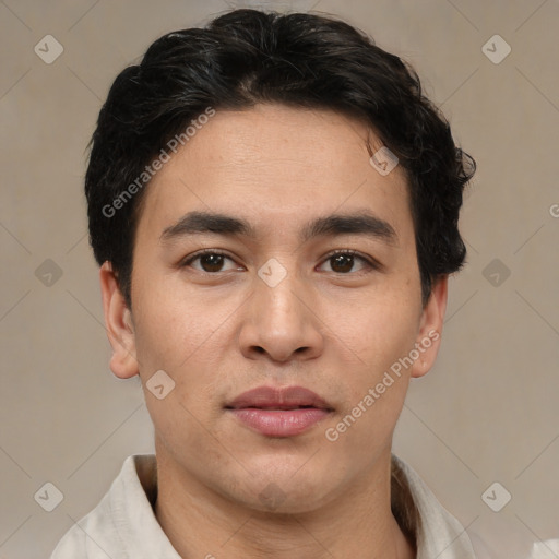 Joyful latino young-adult male with short  brown hair and brown eyes