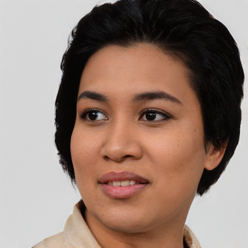 Joyful asian young-adult female with medium  black hair and brown eyes