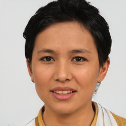 Joyful asian young-adult female with short  black hair and brown eyes