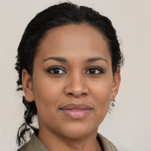 Joyful latino young-adult female with short  brown hair and brown eyes