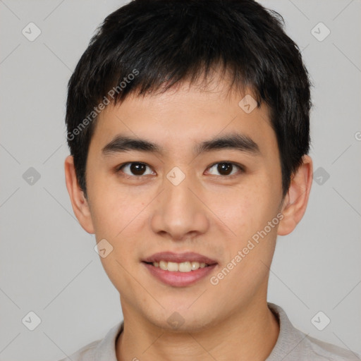 Joyful white young-adult male with short  black hair and brown eyes