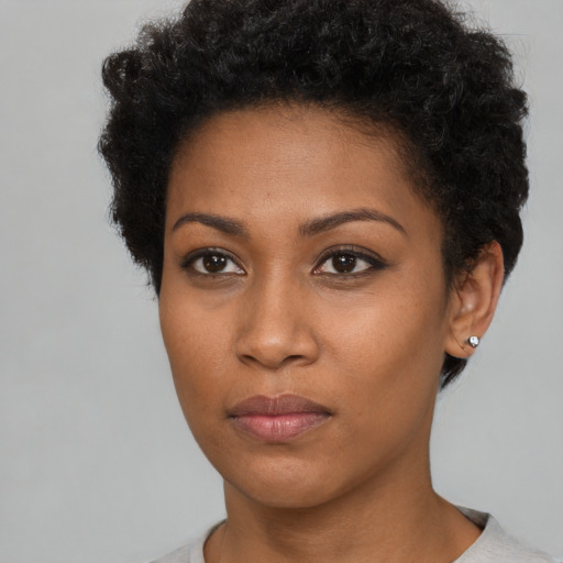 Neutral black young-adult female with short  brown hair and brown eyes