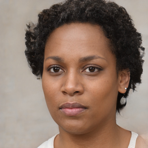 Neutral black young-adult female with short  brown hair and brown eyes