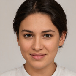 Joyful white young-adult female with medium  brown hair and brown eyes