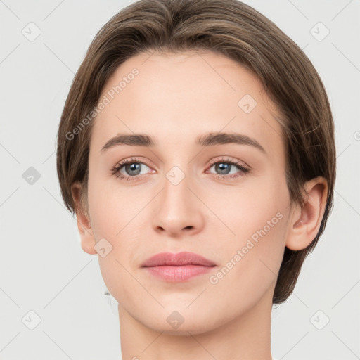 Joyful white young-adult female with medium  brown hair and green eyes