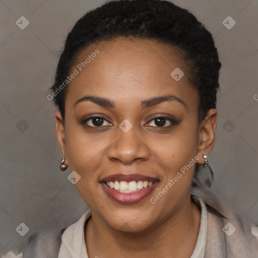 Joyful black young-adult female with short  black hair and brown eyes