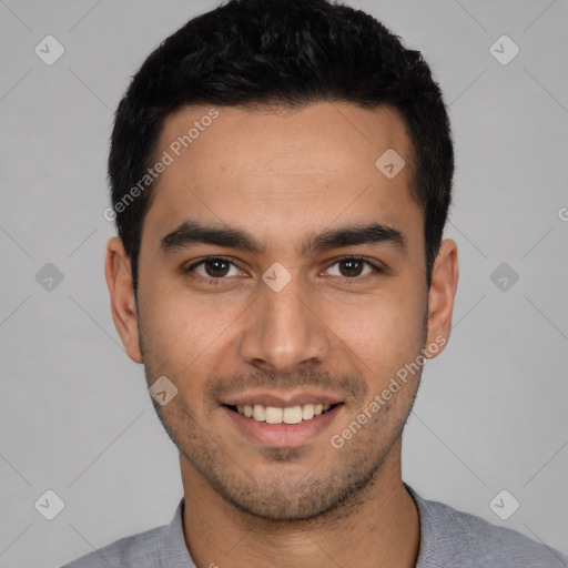 Joyful white young-adult male with short  black hair and brown eyes