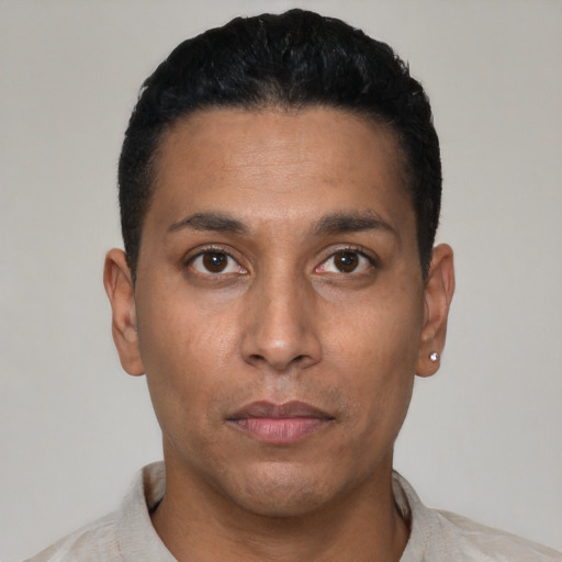 Neutral latino young-adult male with short  black hair and brown eyes