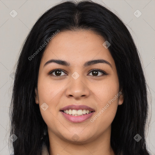 Joyful latino young-adult female with long  brown hair and brown eyes