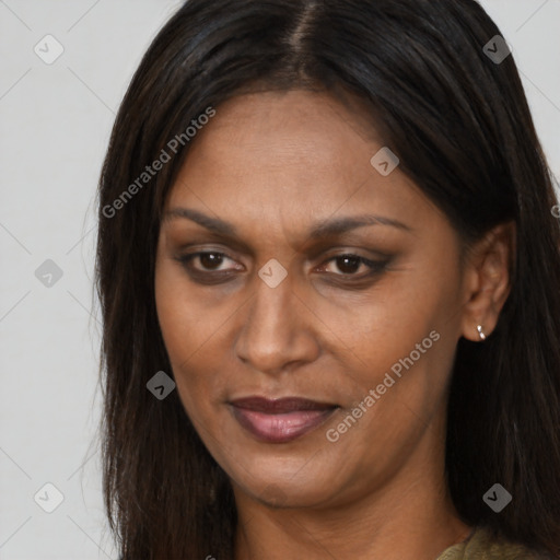 Joyful white adult female with long  brown hair and brown eyes