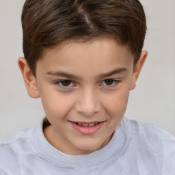 Joyful white child male with short  brown hair and brown eyes