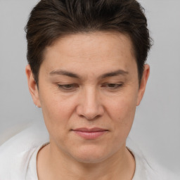 Joyful white adult female with short  brown hair and brown eyes