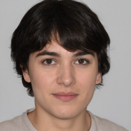 Joyful white young-adult male with medium  brown hair and brown eyes