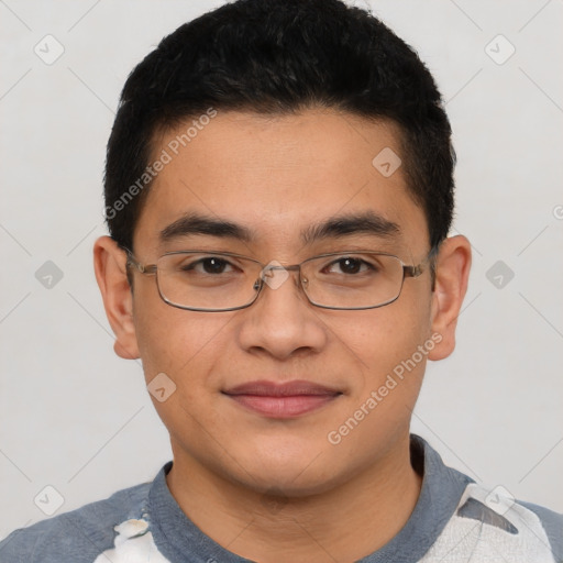 Joyful asian young-adult male with short  black hair and brown eyes