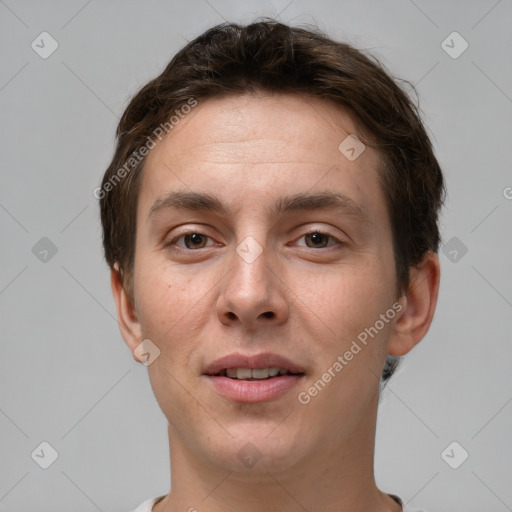 Joyful white young-adult male with short  brown hair and brown eyes