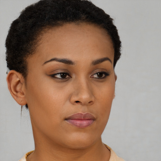 Neutral black young-adult female with short  brown hair and brown eyes