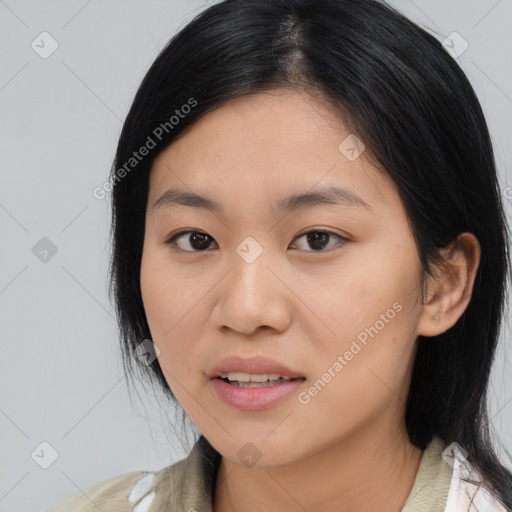 Joyful asian young-adult female with medium  black hair and brown eyes