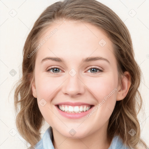 Joyful white young-adult female with medium  brown hair and blue eyes