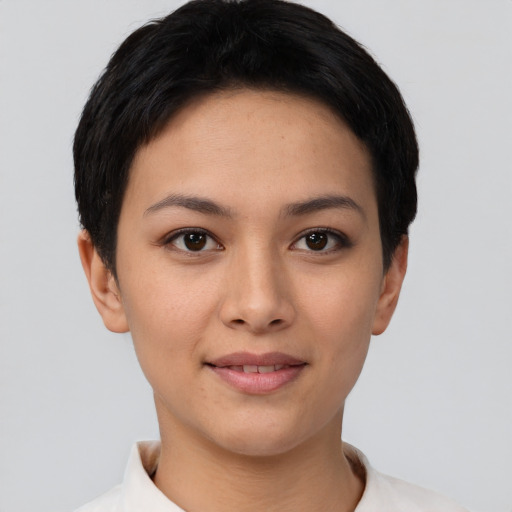 Joyful asian young-adult female with short  black hair and brown eyes