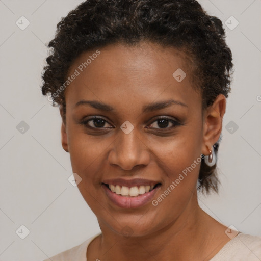 Joyful black young-adult female with short  brown hair and brown eyes