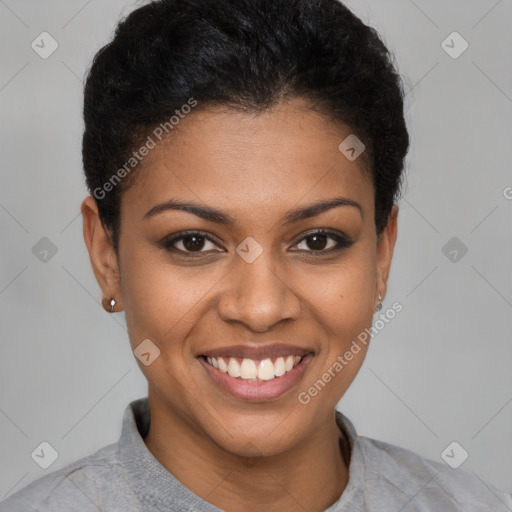 Joyful black young-adult female with short  brown hair and brown eyes