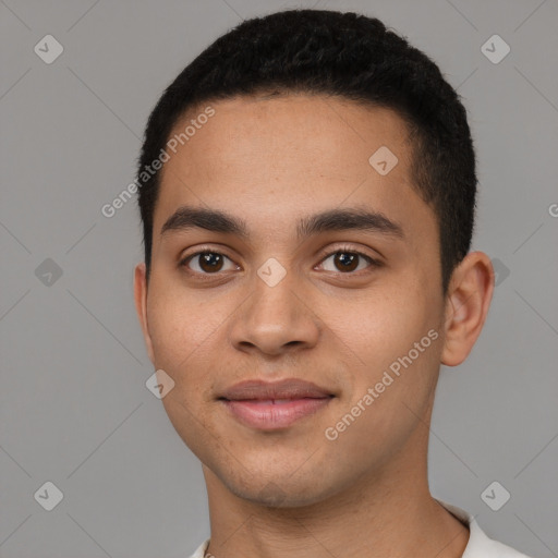 Joyful latino young-adult male with short  brown hair and brown eyes