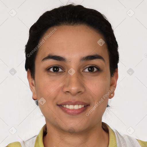 Joyful latino young-adult female with short  black hair and brown eyes