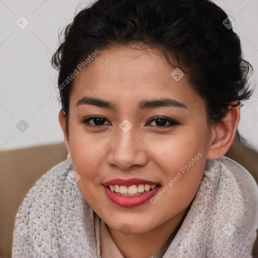 Joyful latino young-adult female with short  brown hair and brown eyes