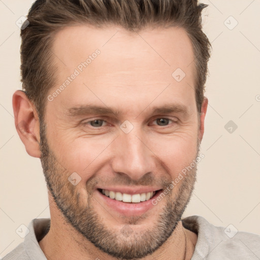 Joyful white adult male with short  brown hair and brown eyes