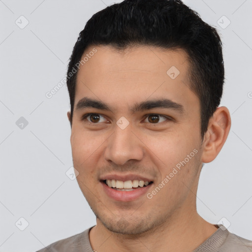 Joyful latino young-adult male with short  black hair and brown eyes