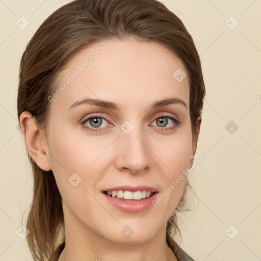 Joyful white young-adult female with long  brown hair and grey eyes