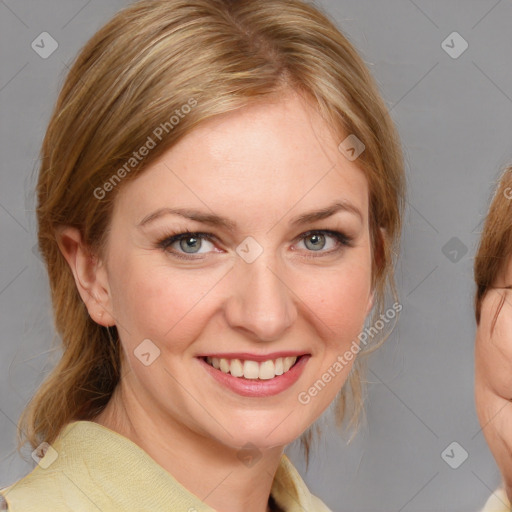 Joyful white young-adult female with medium  brown hair and blue eyes