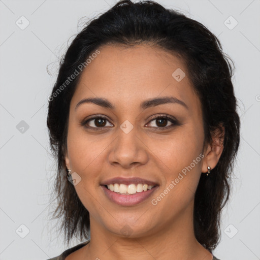 Joyful latino young-adult female with medium  brown hair and brown eyes